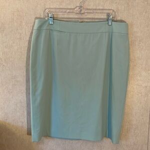 Calvin Klein size 16 midi pencil skirt. Mint green with slit in back.